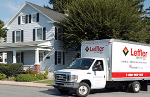 Leffler service truck in front of a house